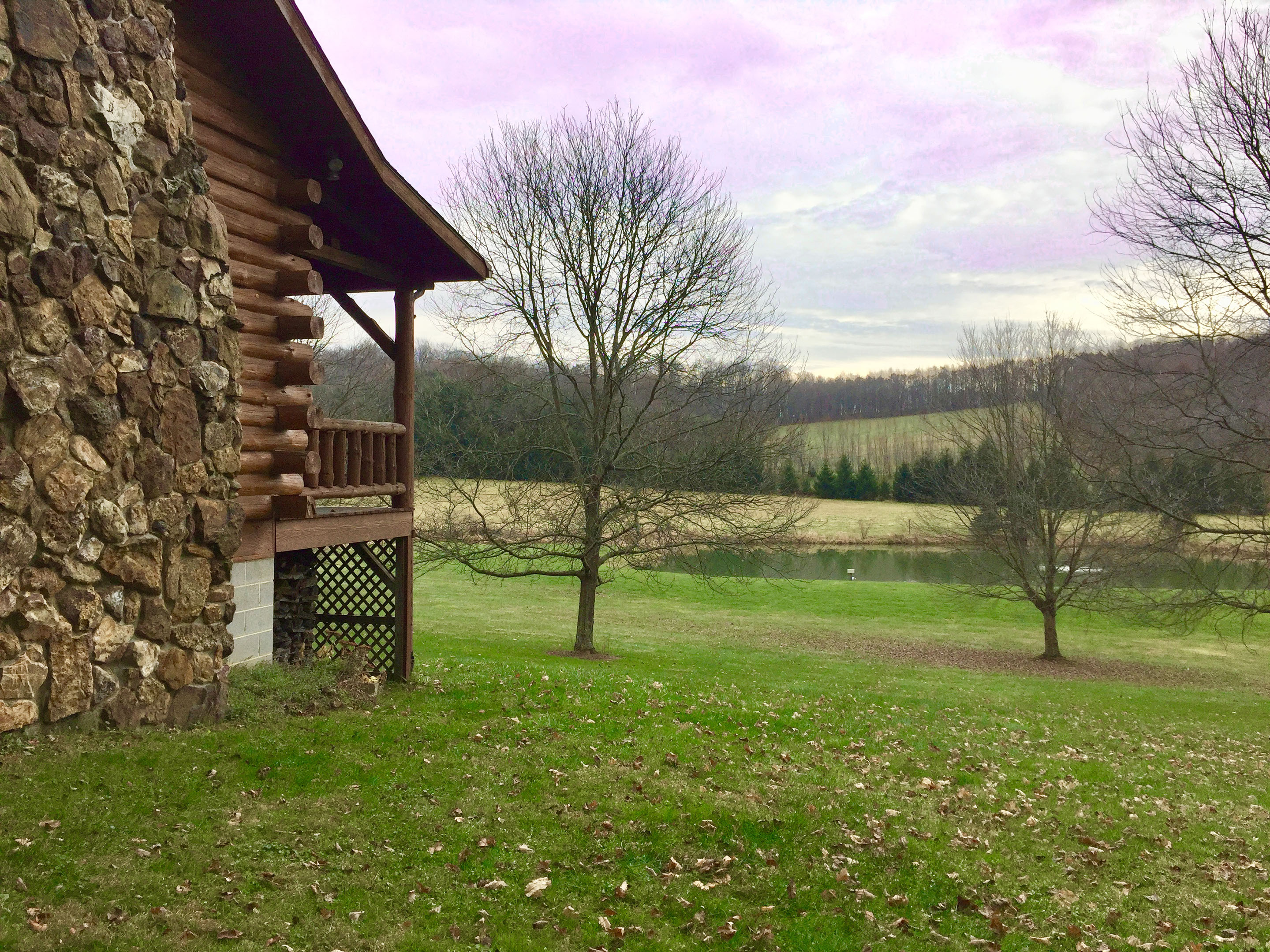 A beautiful stone fireplace at real character to this vacation rental near Mohican State Park, Malabar Farm, and Pleasant Lake.